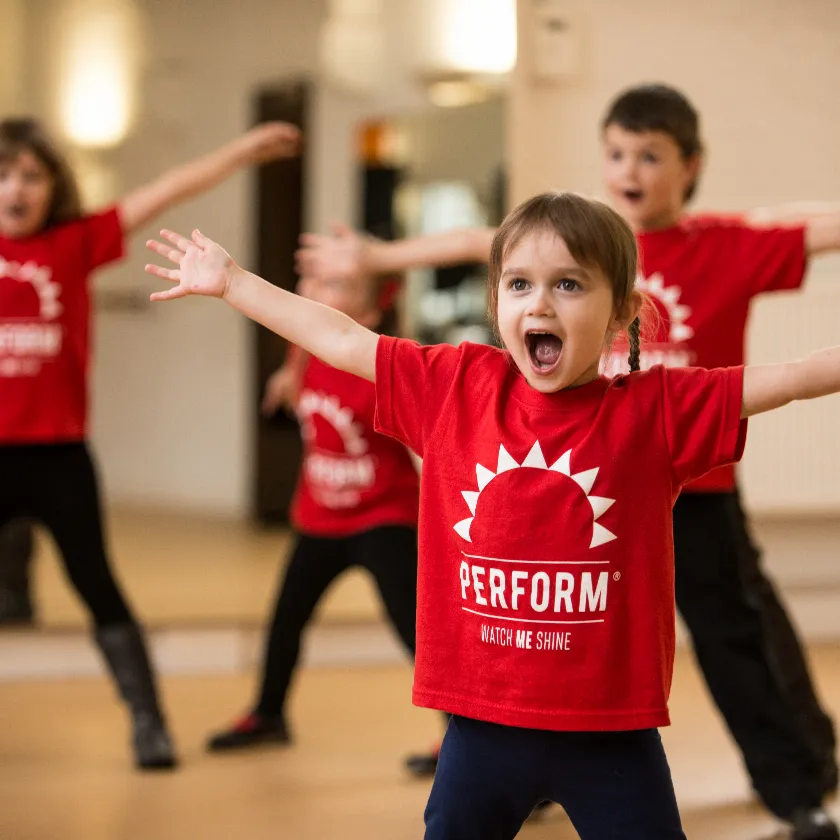 Children performing in a dance class